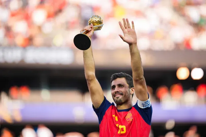 EAST RUTHERFORD, NEW JERSEY - JULY 19: Rodri #16 of Spain lifts up the Golden Ball award after the FIFA World Cup 2026 Final match between Spain and Argentina at New York New Jersey Stadium on July 19, 2026 in East Rutherford, New Jersey. Spain defeated reigning World Cup champions Argentina, who were led by Lionel Messi, with the lone goal coming from Ferran Torres #7 in the 106th minute of extra time. Andrew Harnik/Getty Images/AFP (Photo by Andrew Harnik / GETTY IMAGES NORTH AMERICA / Getty Images via AFP)