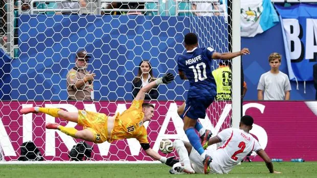MIAMI GARDENS, FLORIDA - JULY 18: Kylian Mbappe #10 of France scores his team's third goal against JDean Henderson #13 of England during the FIFA World Cup 2026 Bronze Final between France and England at Miami Stadium on July 18, 2026 in Miami Gardens, Florida. (Photo by Luke Hales/Getty Images)