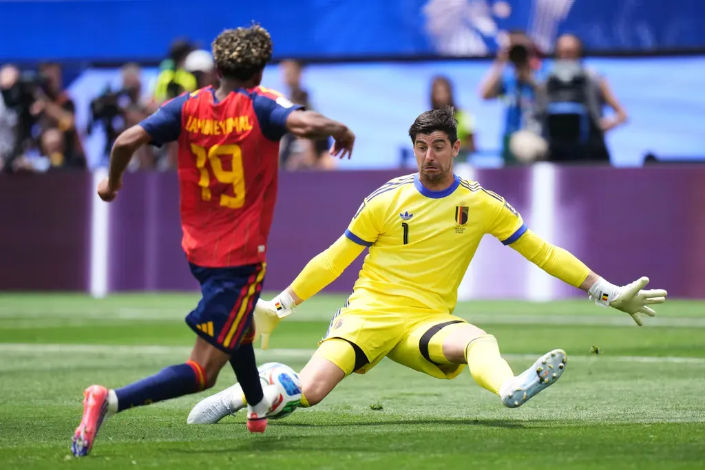 Belgium goalkeeper Thibaut Courtois (1) saves a shot by Spain's Lamine Yamal (19) during the World Cup quarterfinal soccer match between Spain and Belgium in Inglewood, Calif., near Los Angeles, Friday, July 10, 2026. (AP Photo/Jae C. Hong)