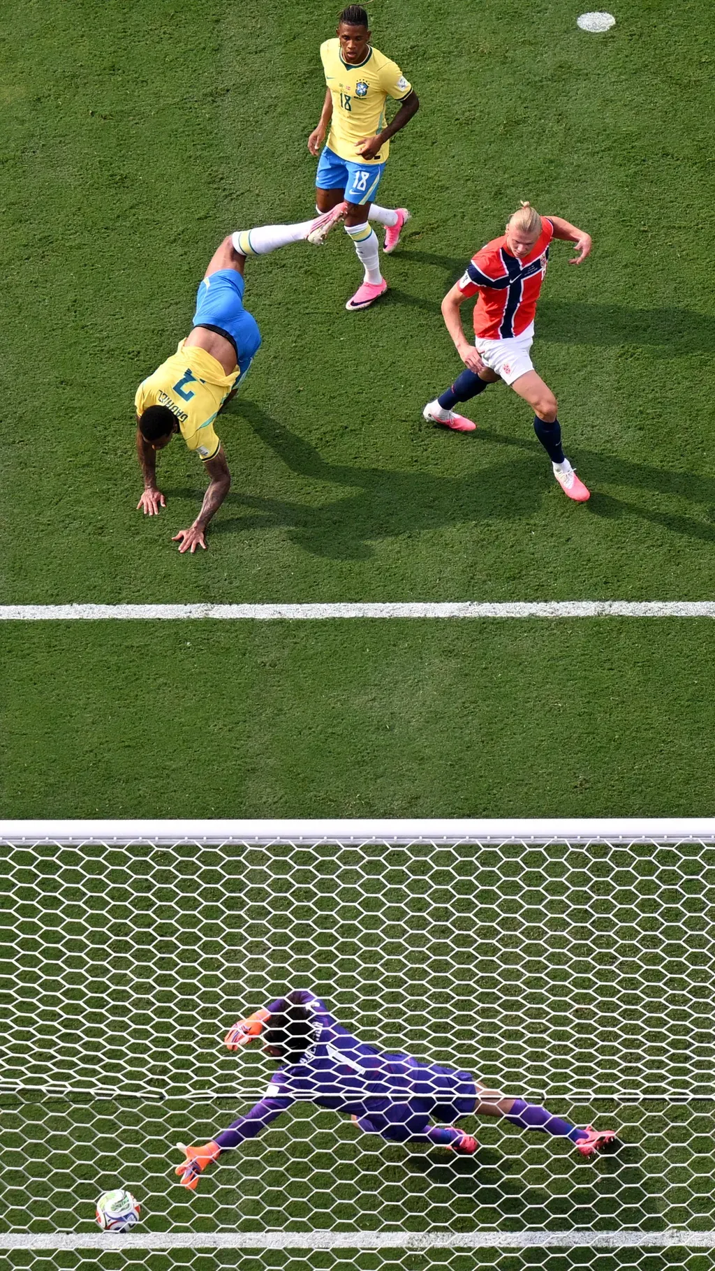 Norway's forward #09 Erling Braut Haaland (C) scores his team�s first goal during the 2026 World Cup round of 16 football match between Brazil and Norway at the New York/New Jersey Stadium in East Rutherford on July 5, 2026. (Photo by Jewel SAMAD / AFP)