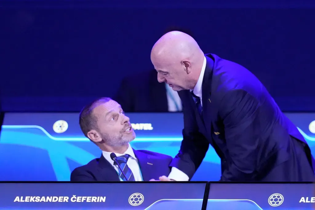 FILE - FIFA President Gianni Infantino, right, talks to UEFA President Aleksander Ceferin during the FIFA 75th Congress at the Conmebol Convention Center in Luque, Paraguay, Thursday, May 15, 2025. (AP Photo/Fernando Calistro, File)